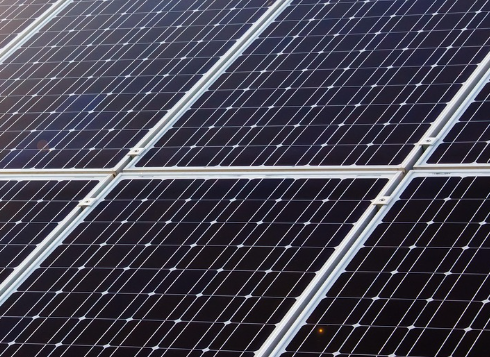 Technicians inspecting solar installation